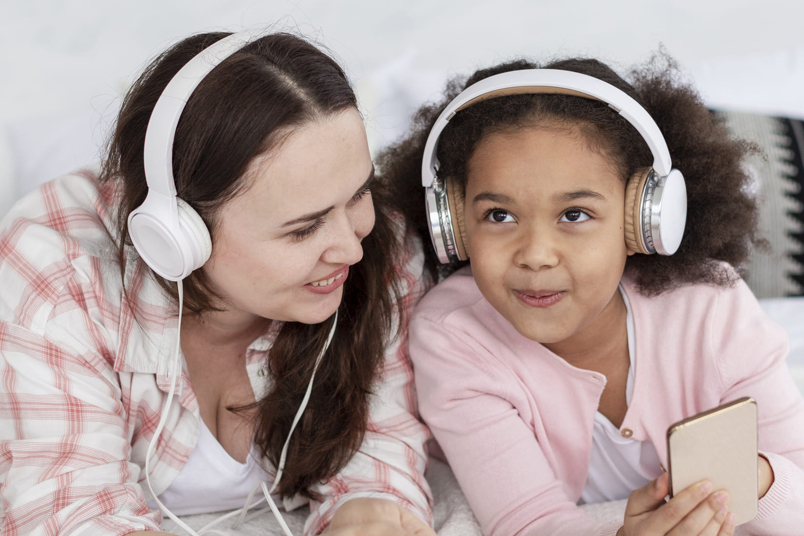 happy-mother-daughter-listening-music